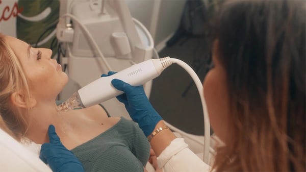DLK dermatologist uses rf microneedling tool on patient