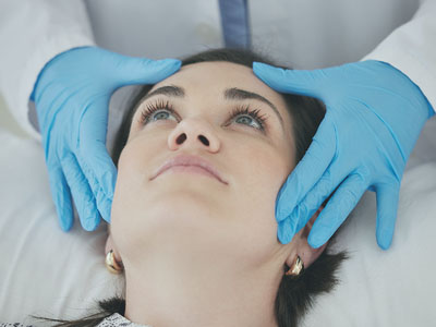 Physican Examining Patients Face